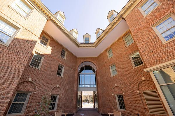 exterior shot of a new, brick residence hall on a sunny day